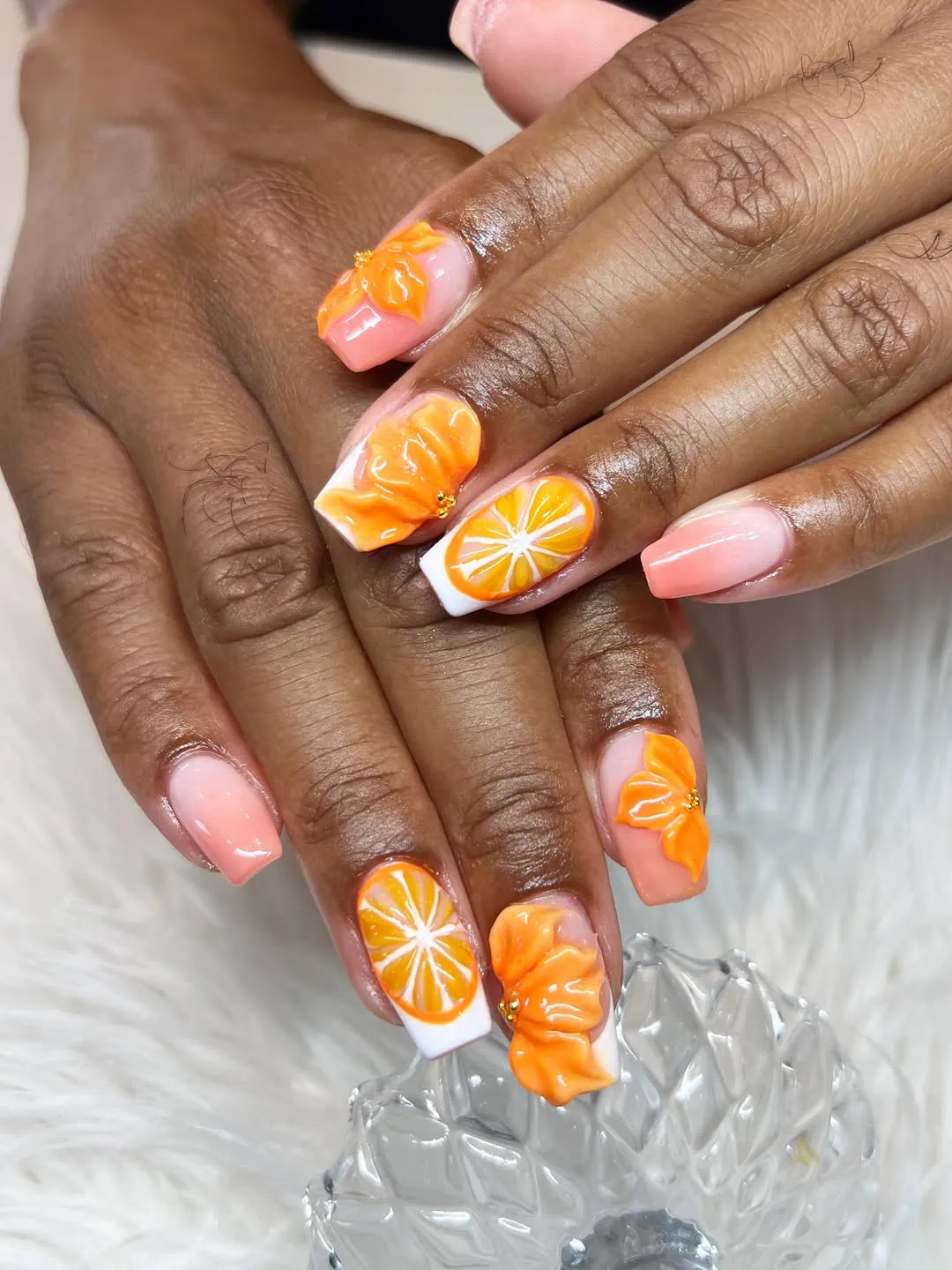 Peach gradient nails with 3D orange bows and citrus slice art