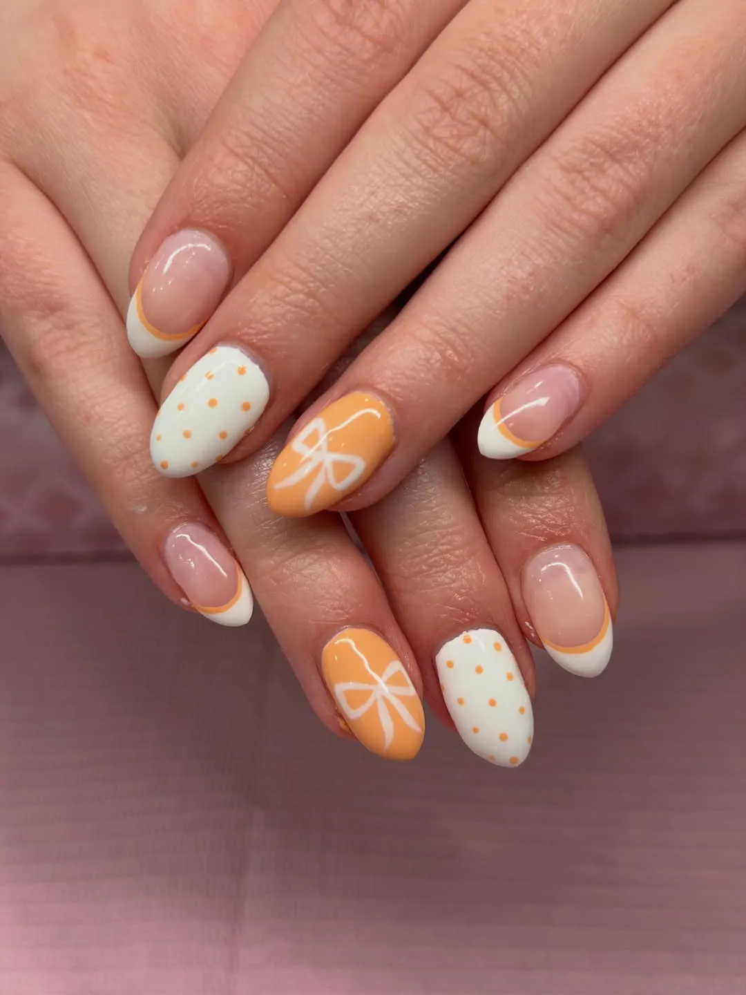 Double-line French tips with bows and dots