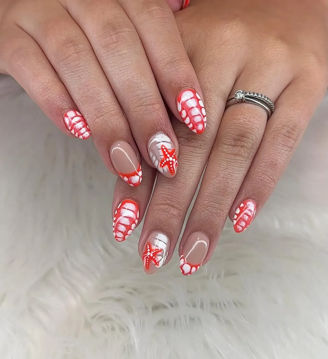 Orange-and-white shell-like patterns with starfish accent