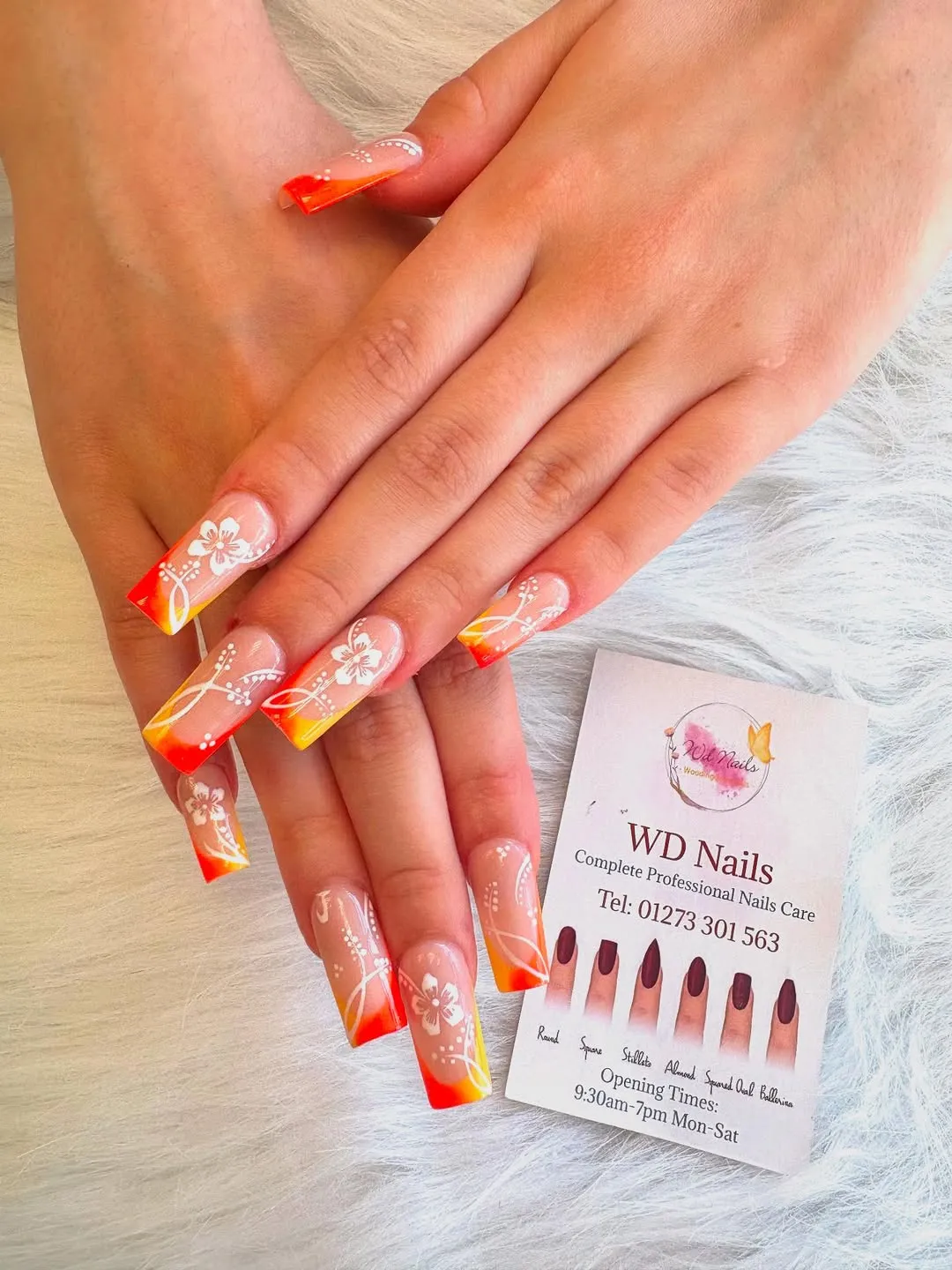 Orange-yellow gradient tips with white florals