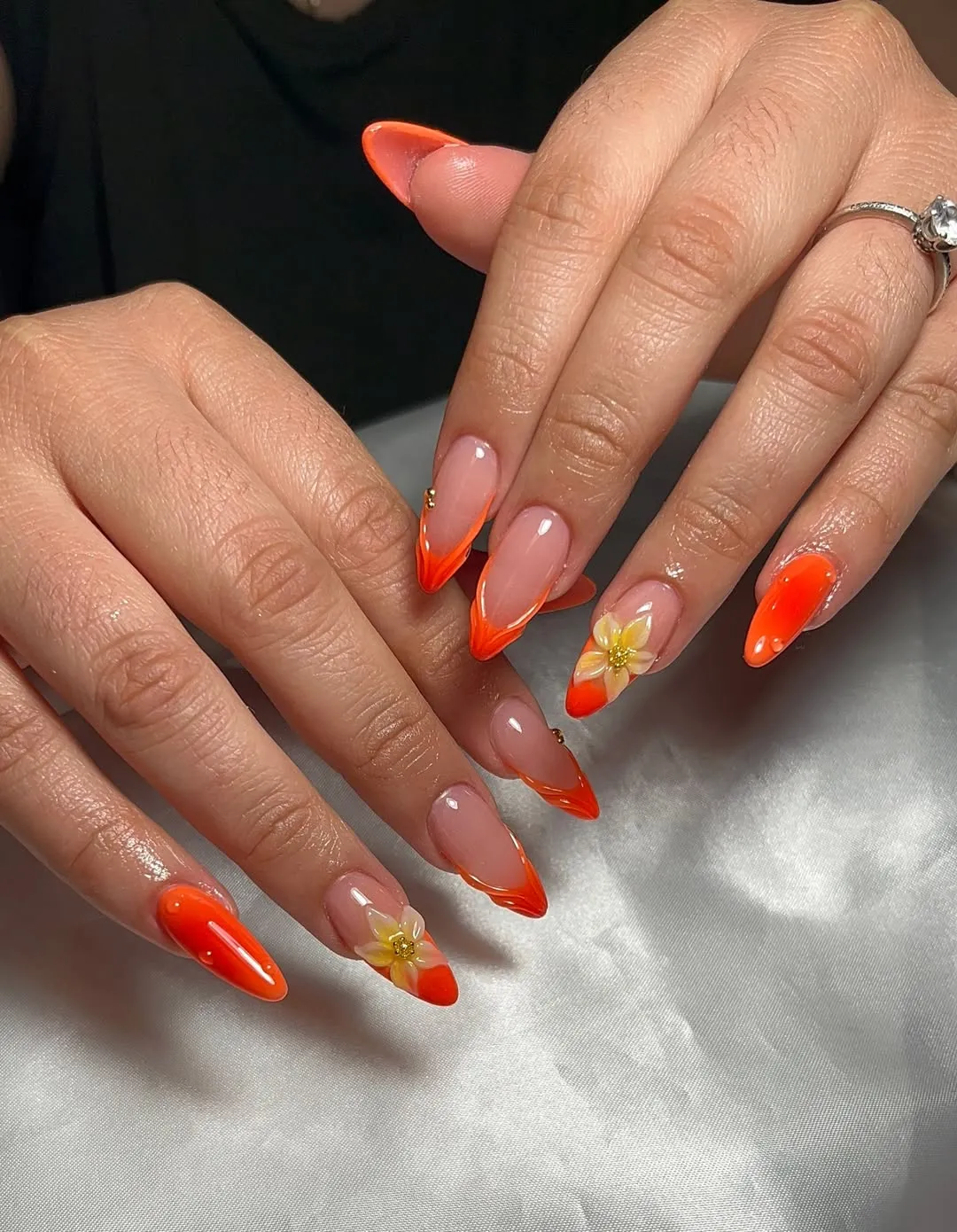 Flame-Shaped Orange French Tips with Yellow Floral Accents