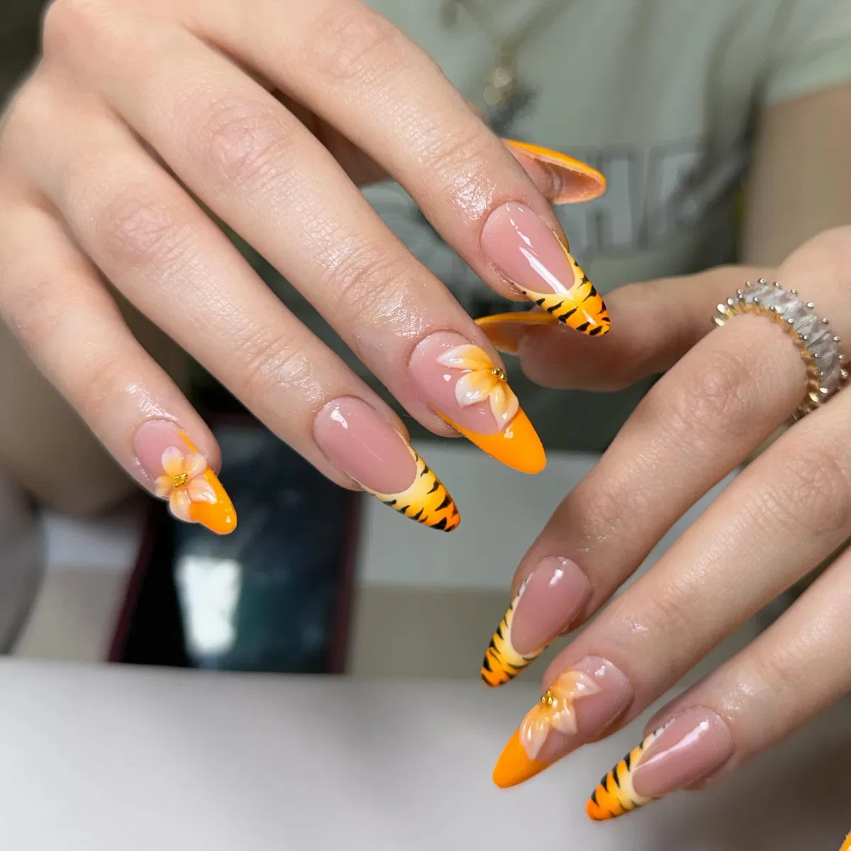 Orange French Tips with Tiger-Stripe Accents and 3D-Style Flowers