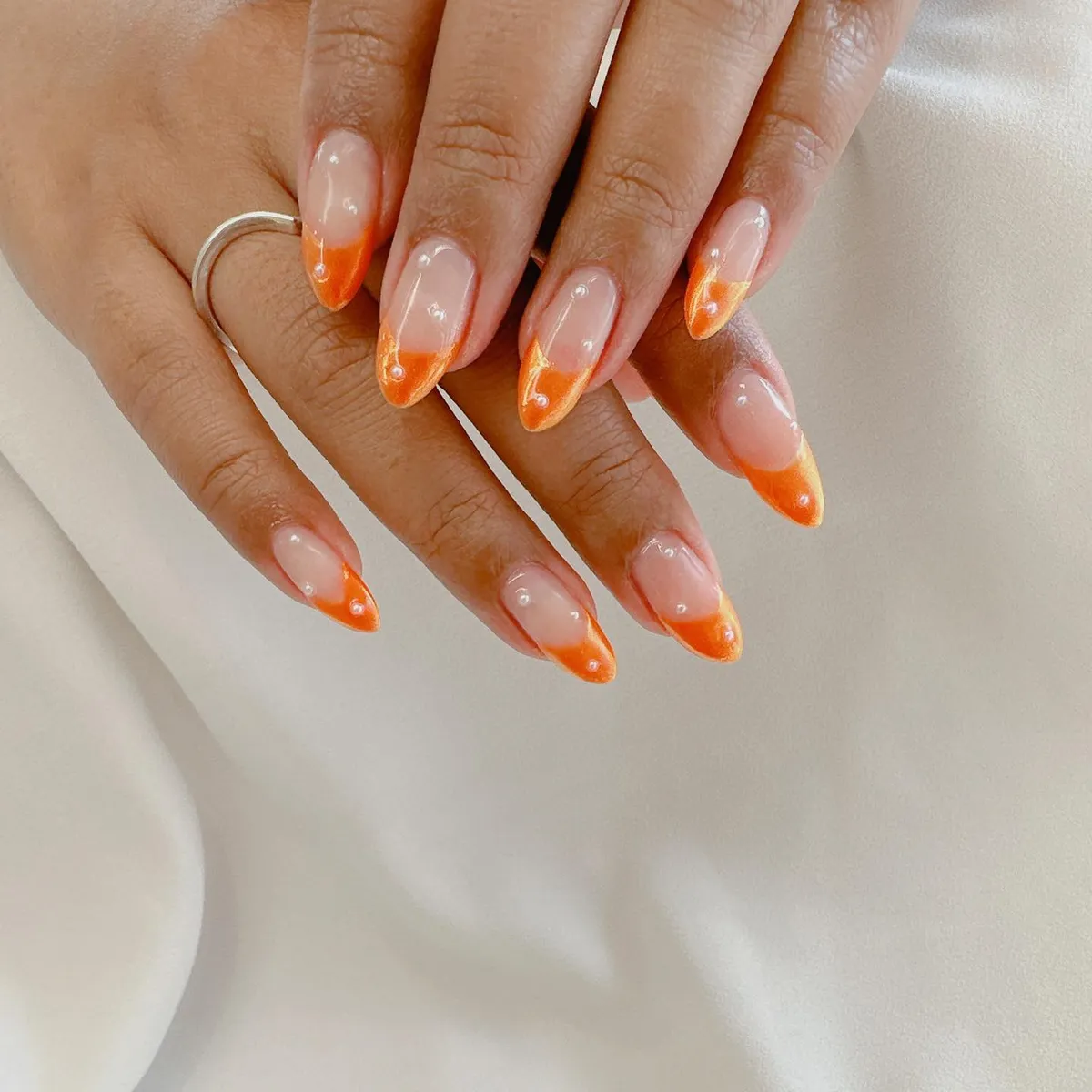 Marbled Orange French Tips with Small Bead Accents