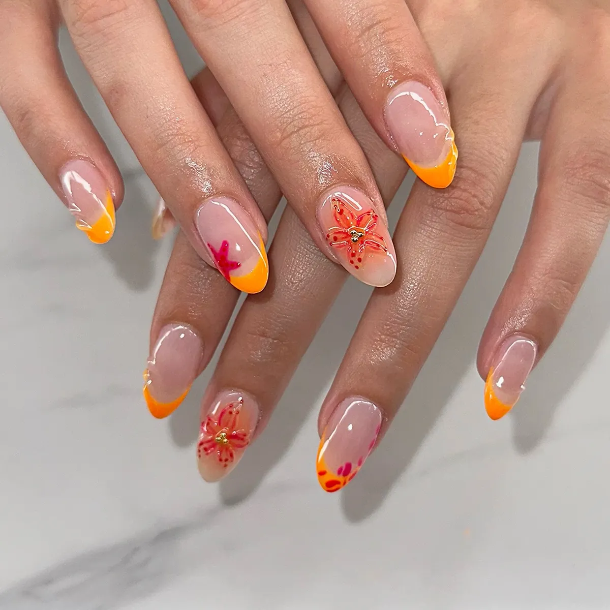 Almond Orange French Tips with Floral Accent Nails
