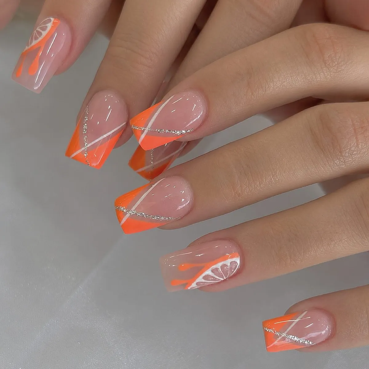Neon Orange Diagonal French Tips with White Lines and Silver Accents