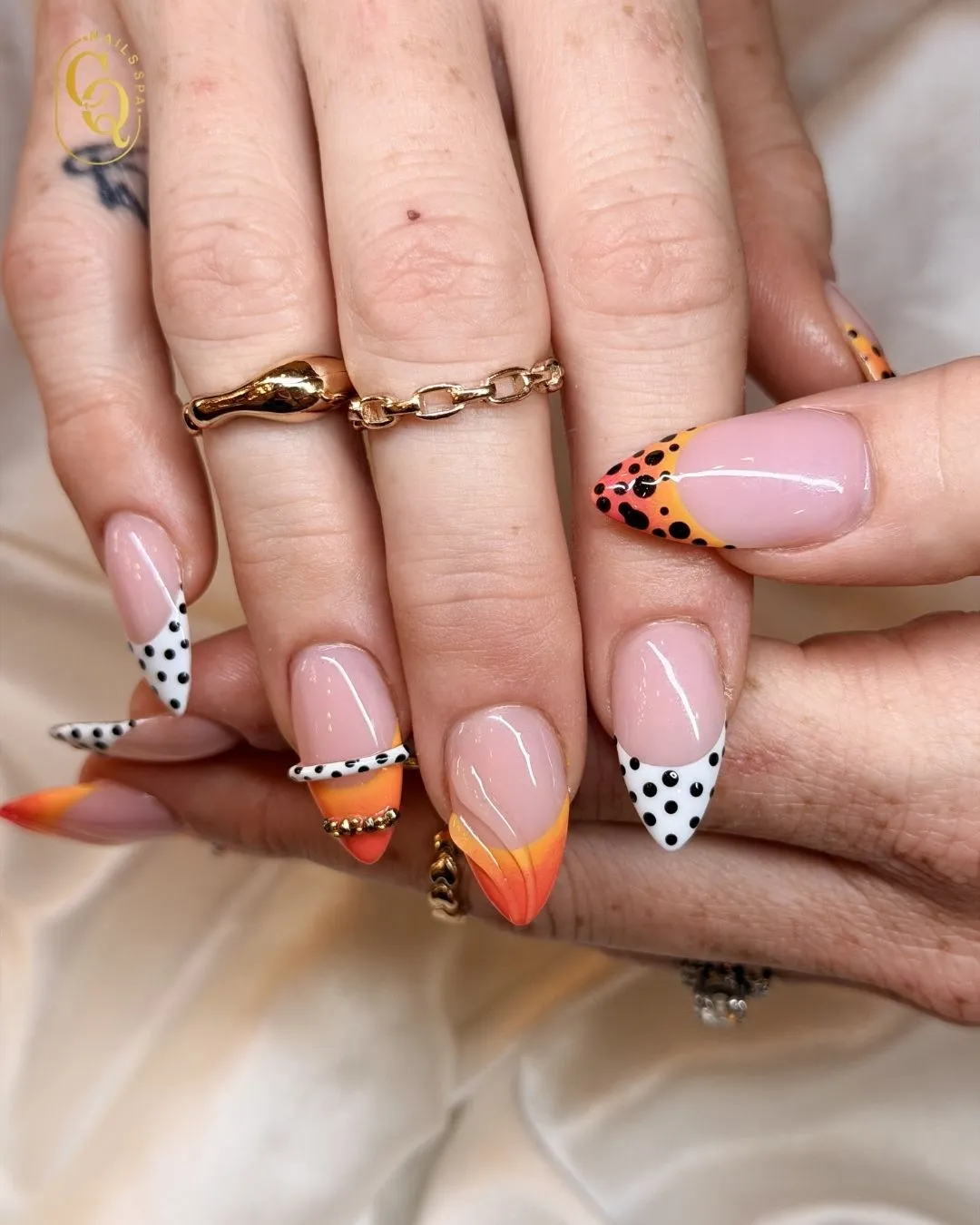 Nude base with orange gradients and polka-dot French tips