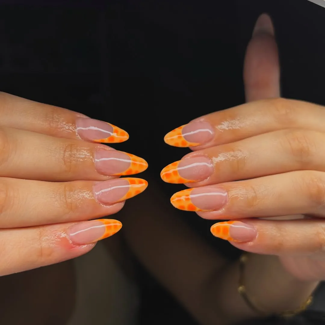Mottled Orange French Tips on a Nude Base