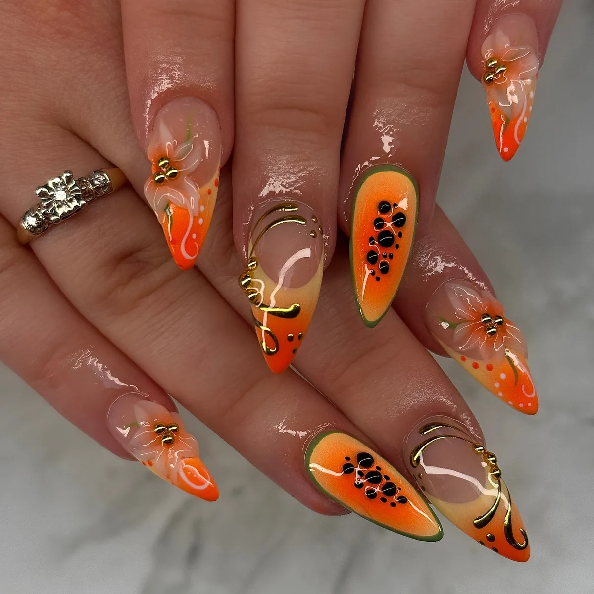 Orange gradients with green outlines, gold lines, and raised flowers