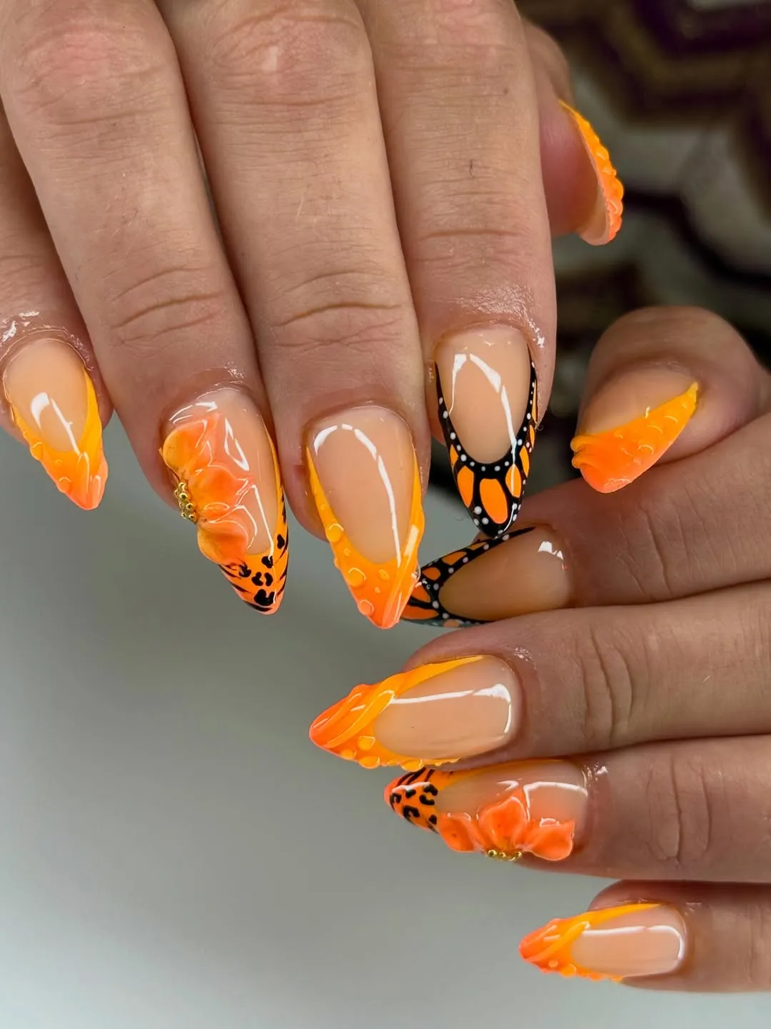 Orange French Tips with 3D Flowers and Black Graphic Accents