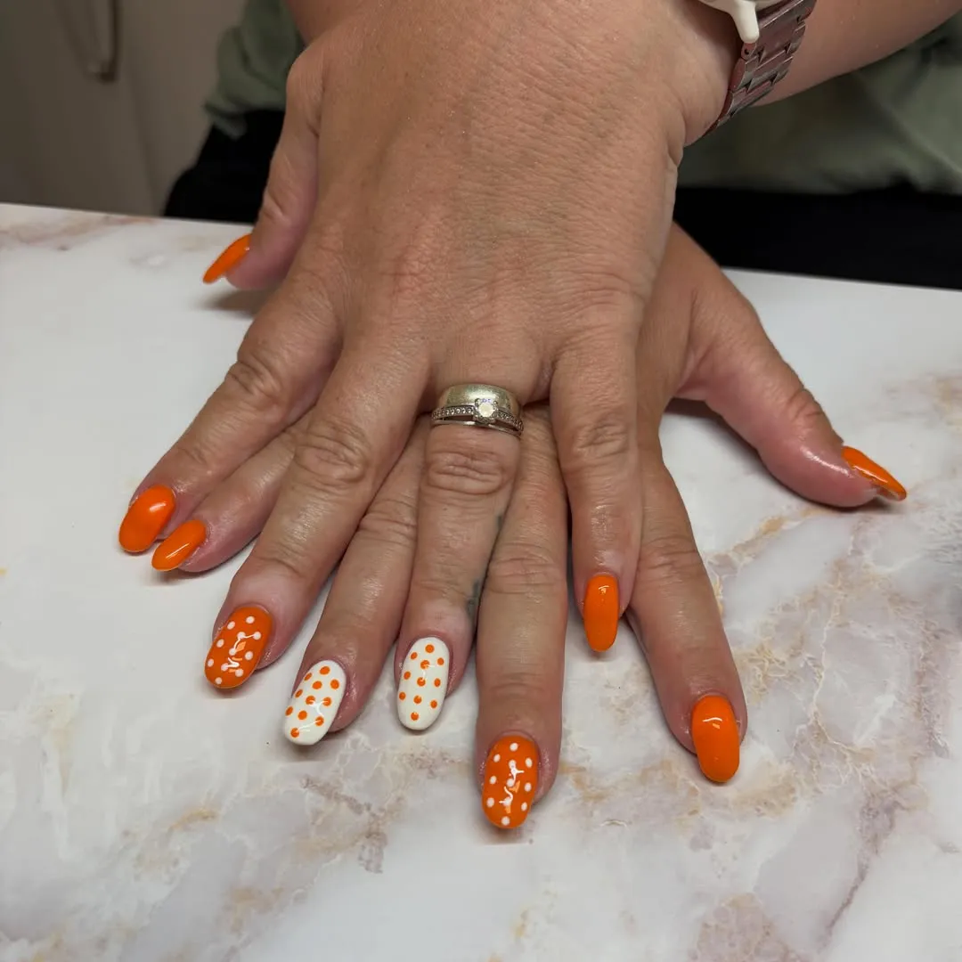 Bright orange solids with white-and-orange polka dot accents