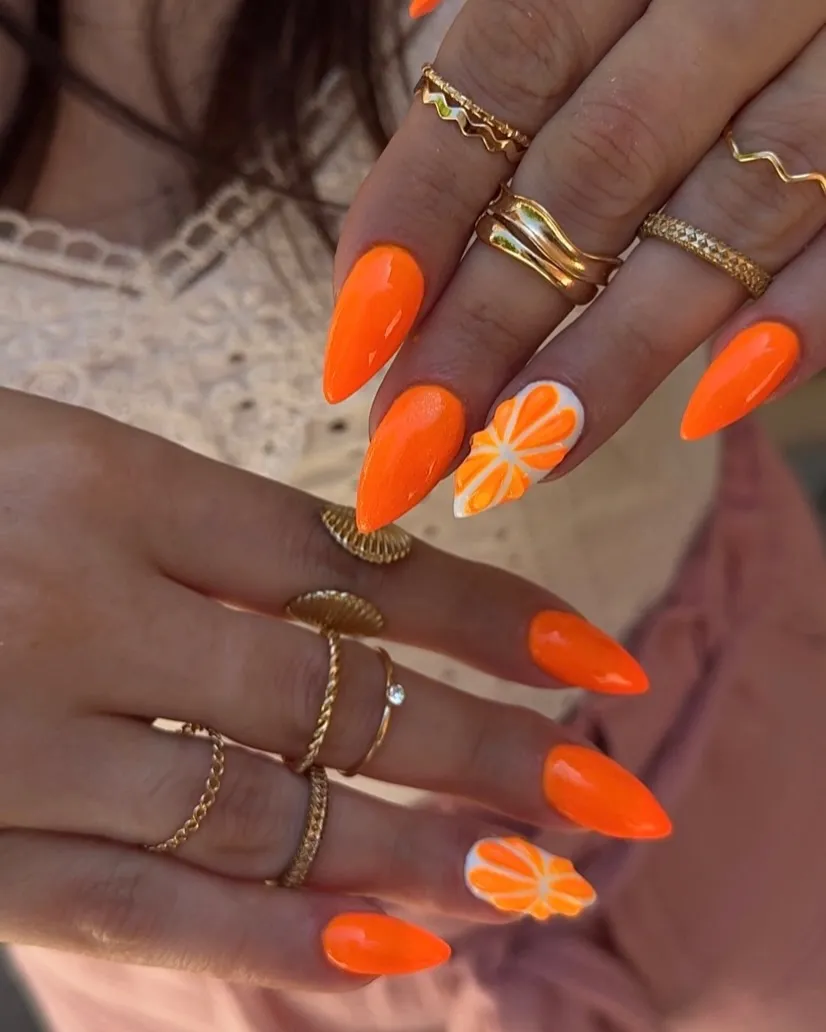 Solid bright orange with orange-segment accent nails