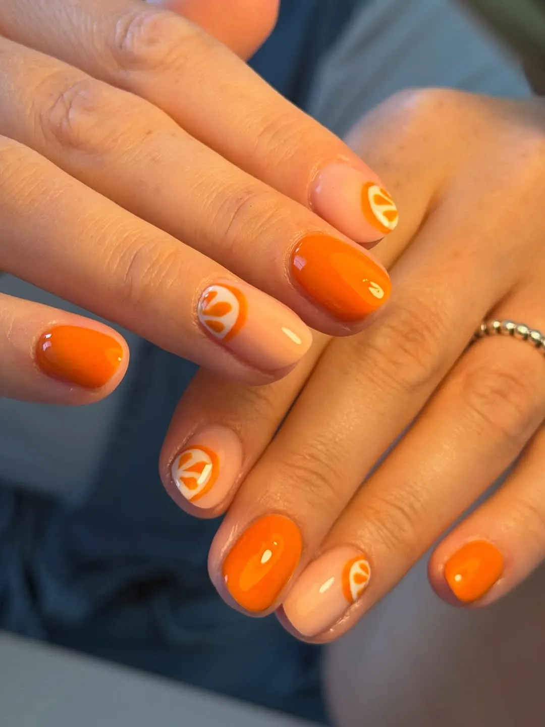 Short orange set with minimal citrus slice details