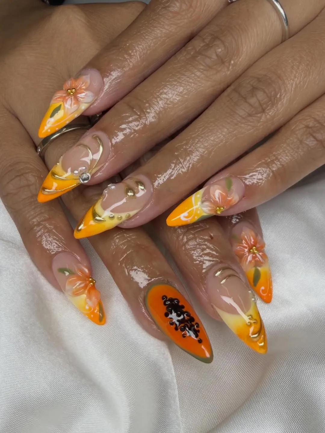Orange-yellow gradients with florals and black bead cluster accent