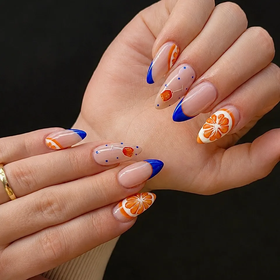 Blue French tips with orange citrus accents