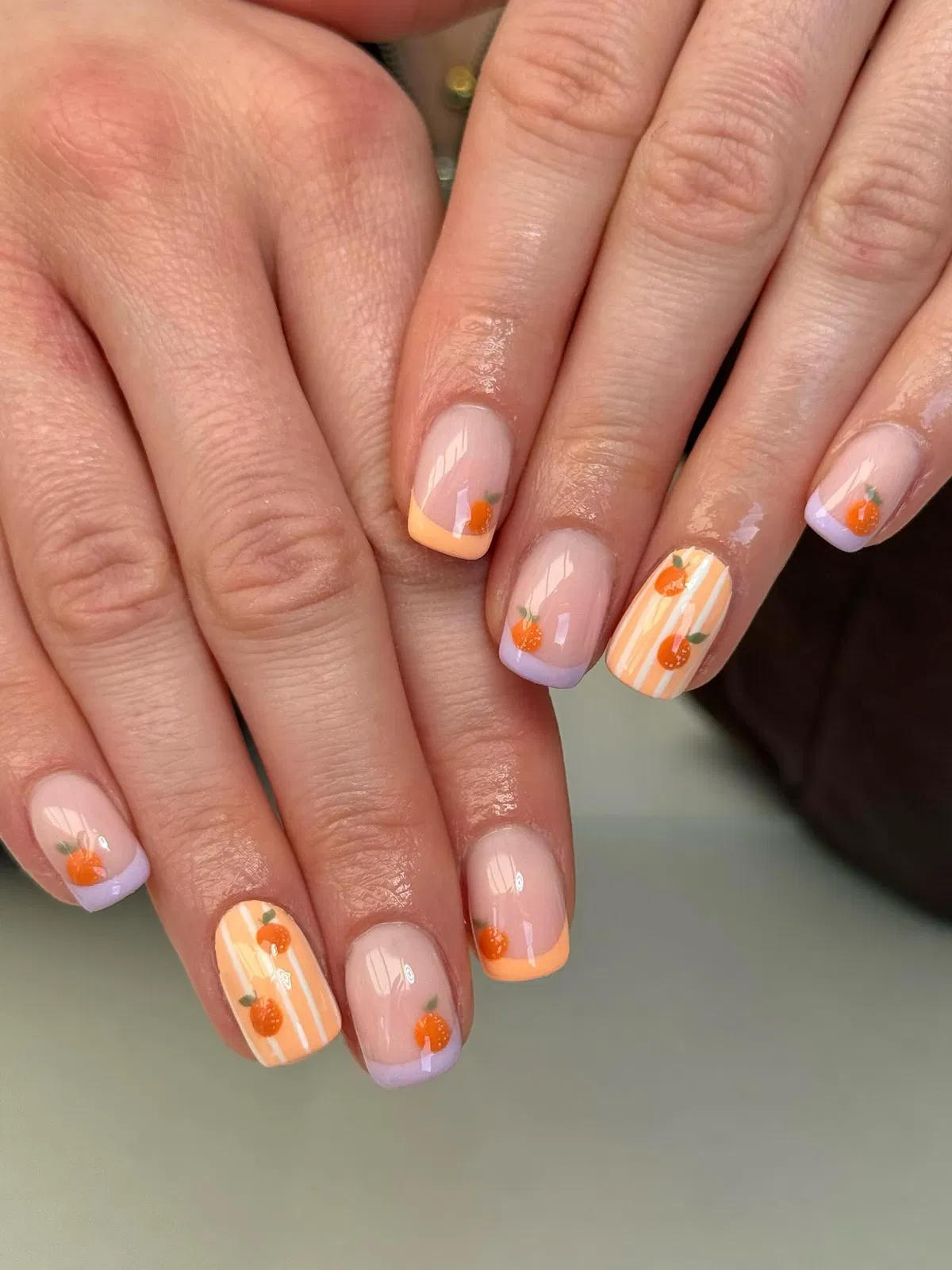 Pastel French Tips with Tiny Orange Fruit Motifs