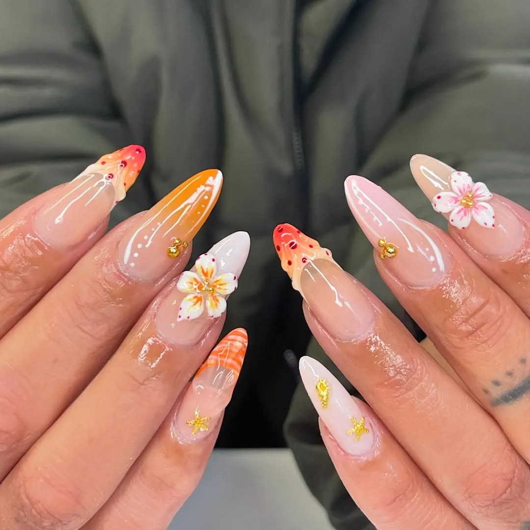 Nude-to-orange ombre with 3D flowers, gold studs, and starfish charms