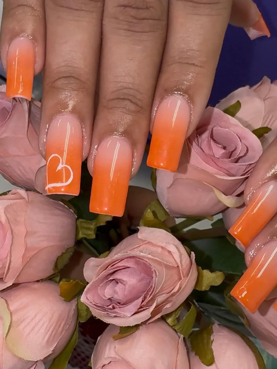 Square nude-to-orange ombre with a white heart outline accent
