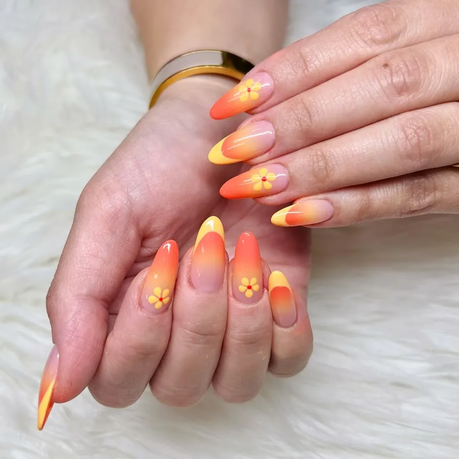 Orange-yellow ombre with small daisy-like flower motifs