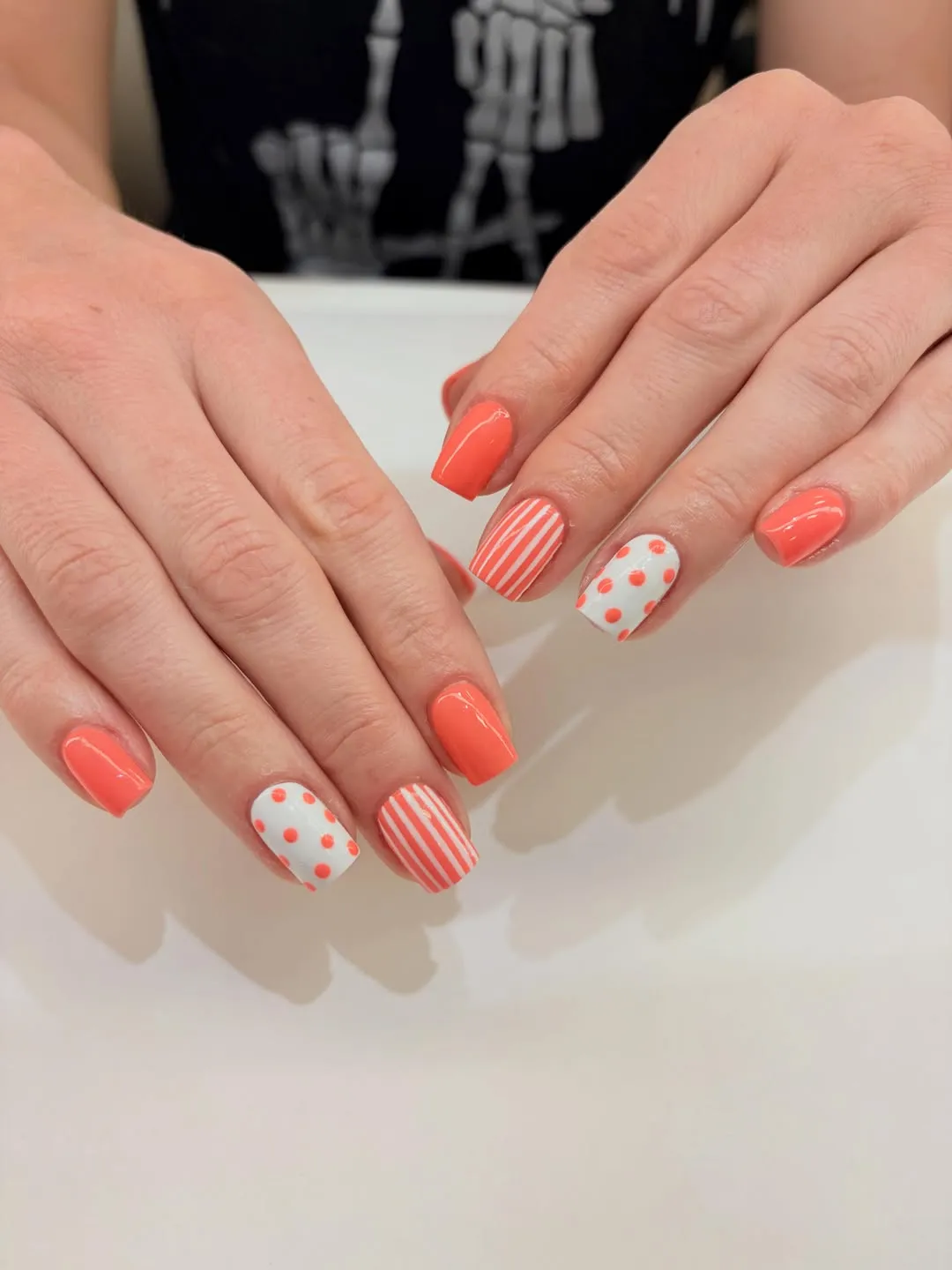 Coral-orange set with polka dot and stripe accents