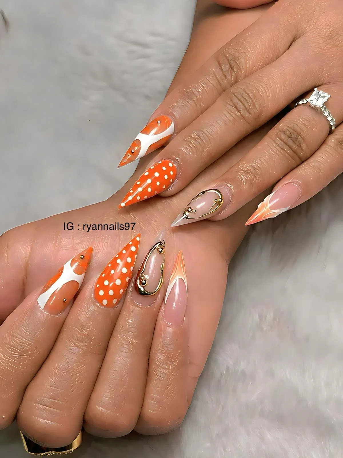 Orange polka dots with abstract swirls and gold outline accents