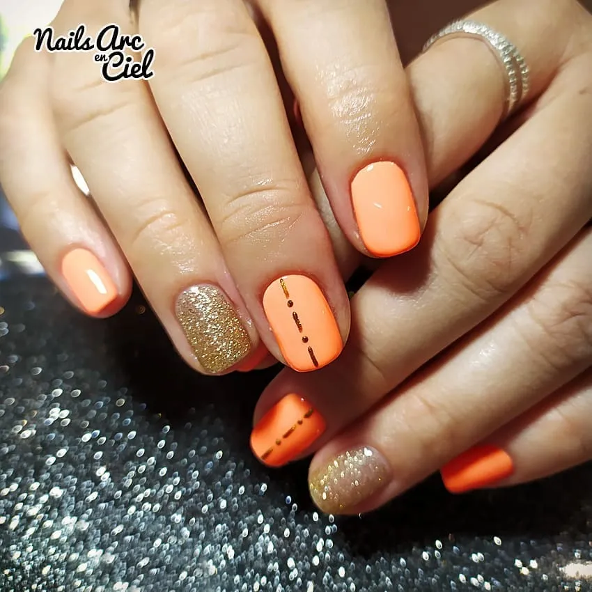 Pastel orange with glitter accent and dotted-line detail