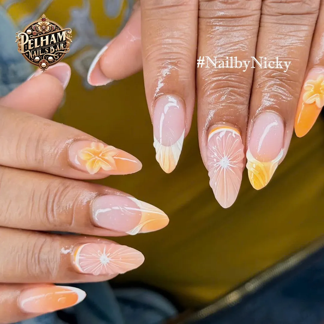Almond nude nails with pastel orange tips and white floral line art