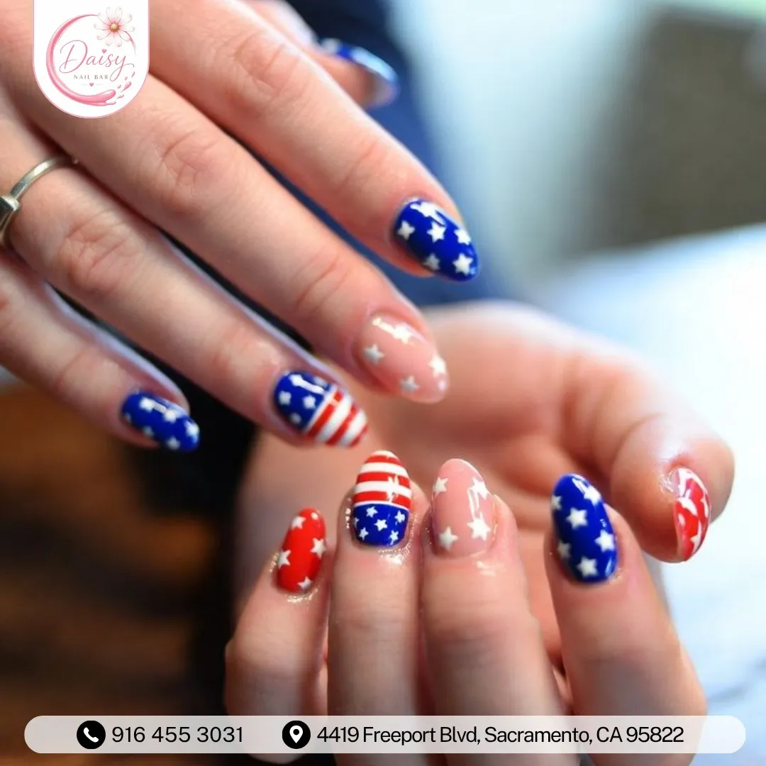 Blue star nails with red-and-white stripe accents