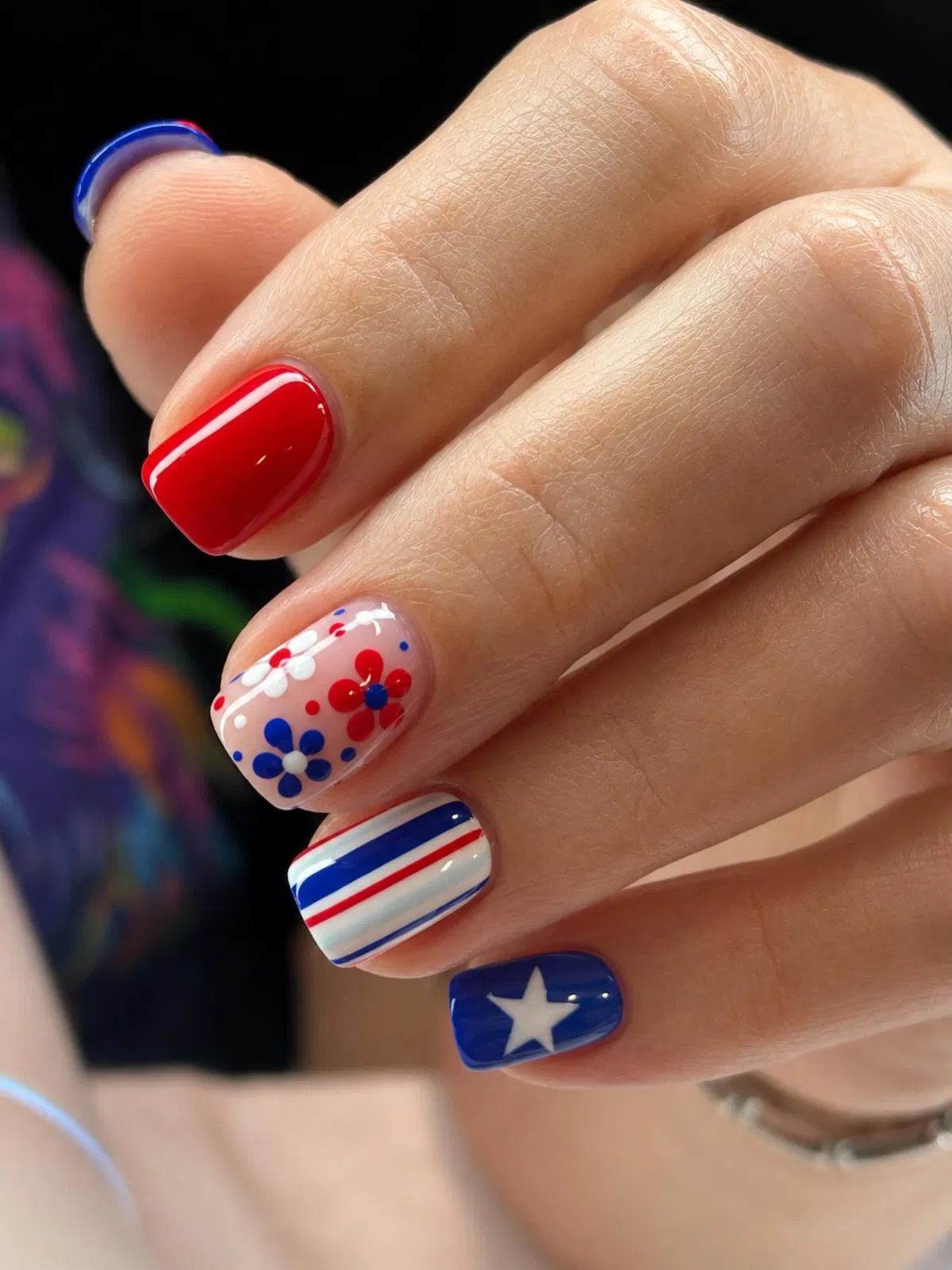 Red solid with floral dots, stripes, and a single star