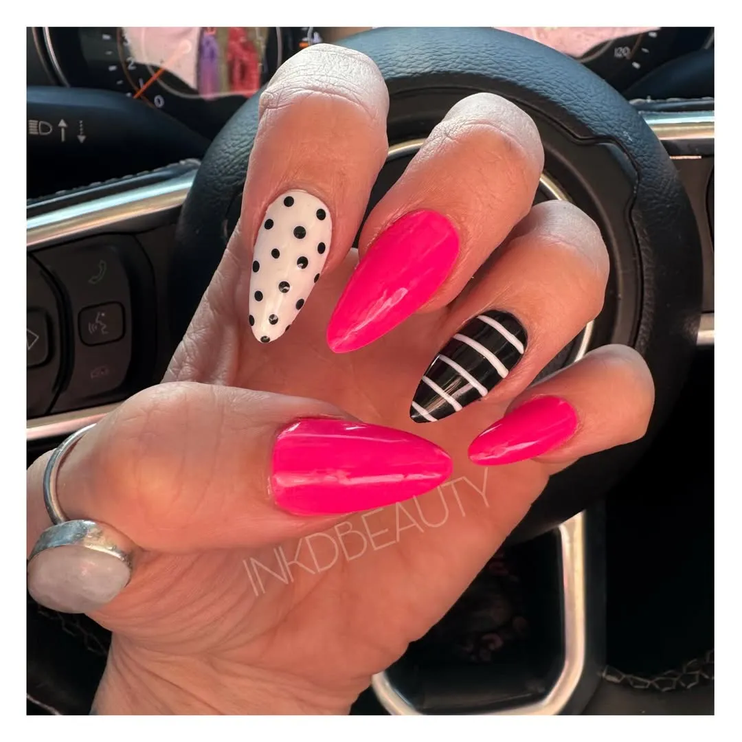 Hot Pink Almond Nails with Polka Dots and Striped Accent