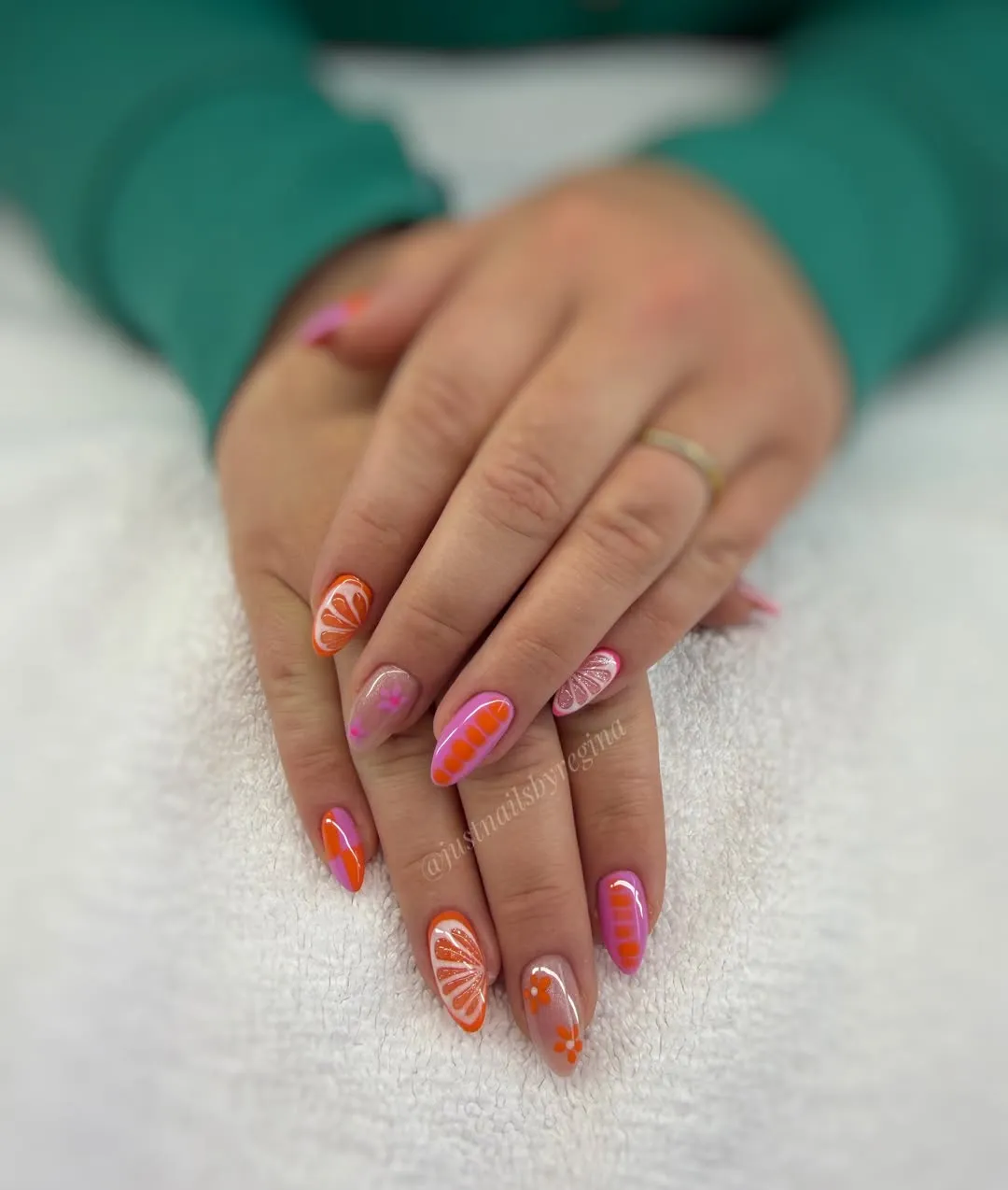 Orange-slice motifs with pink-orange graphic accents