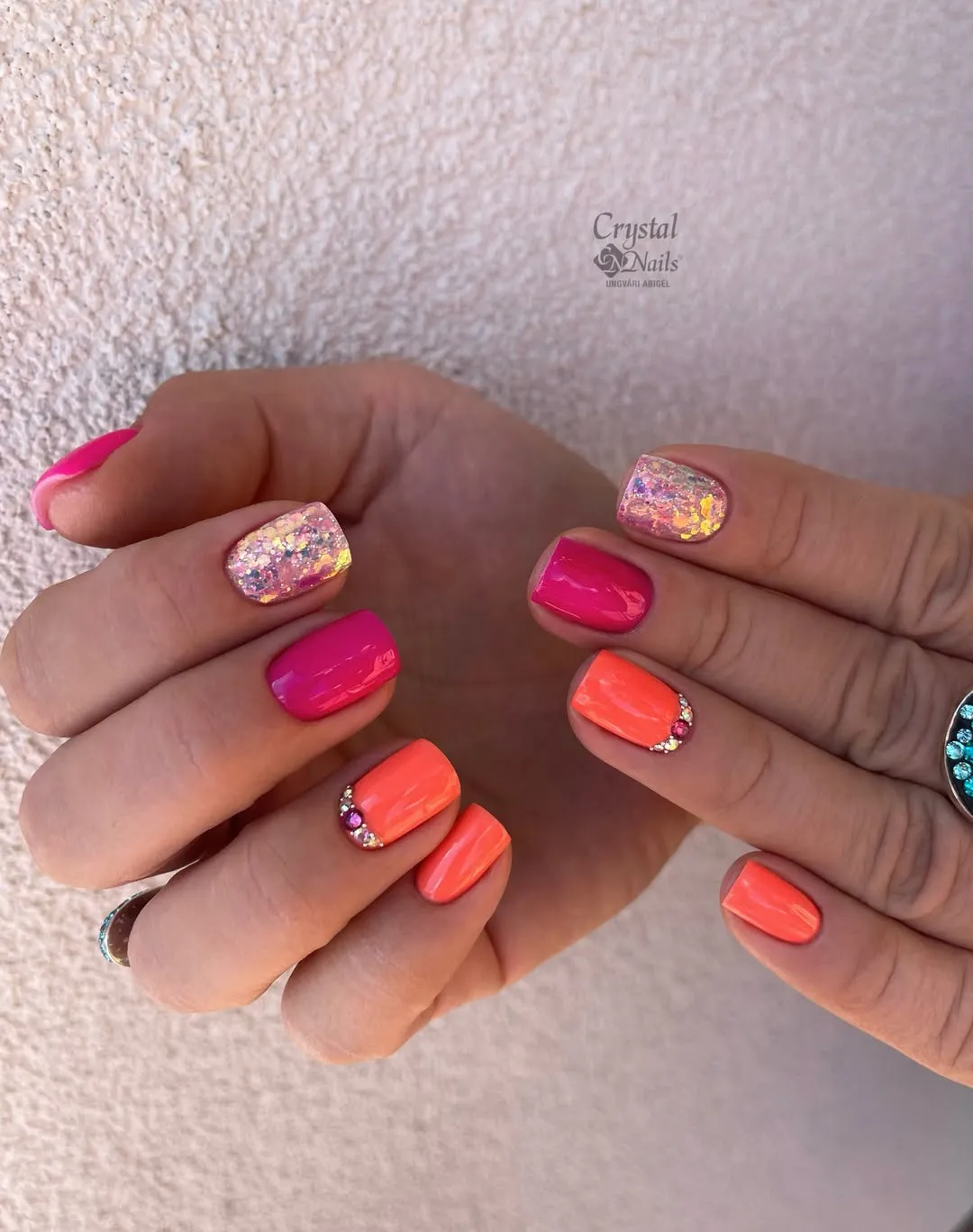 Bright pink and neon orange with sparkle accents