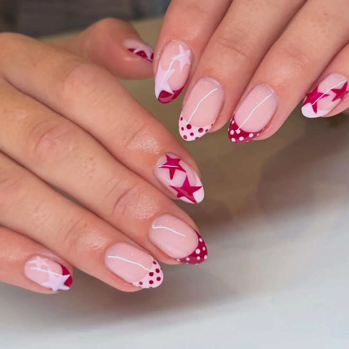 Star accents with pink polka-dot French tips