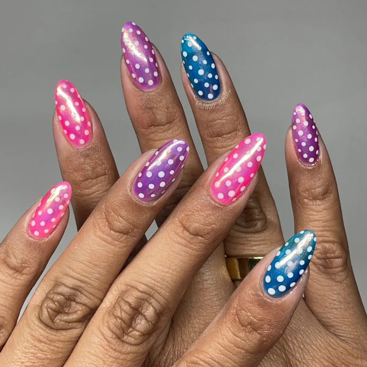 Bright multicolor polka dots on glossy nails