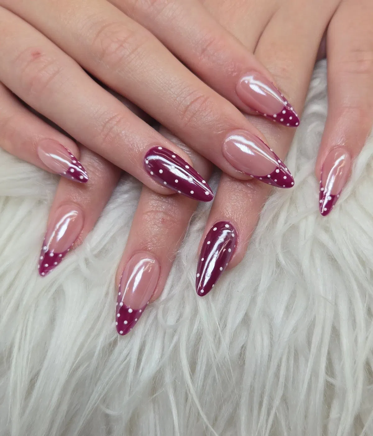 Burgundy polka-dot French tips on nude base