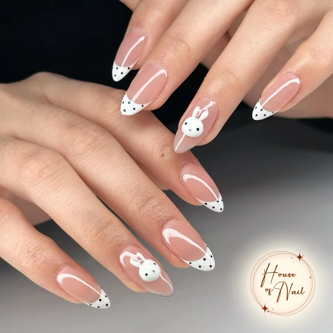 White polka-dot French tips with raised bunny accents