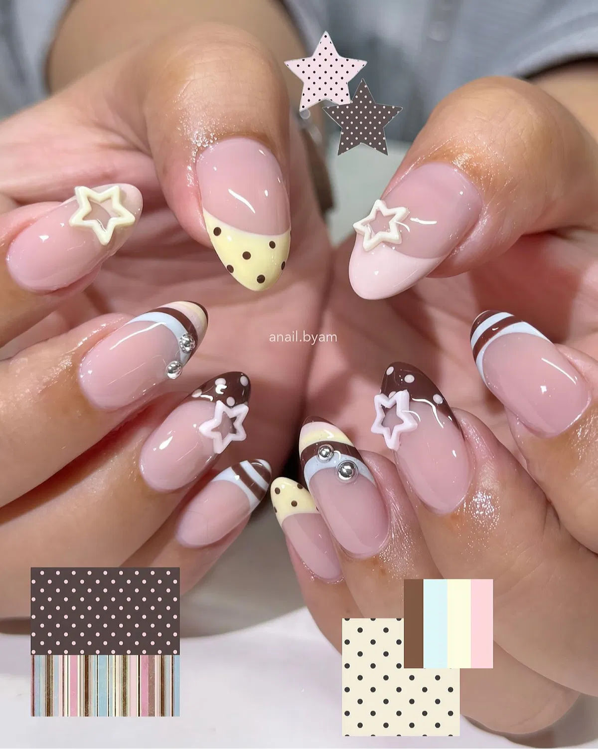 Pastel French tips with polka dots and star accents