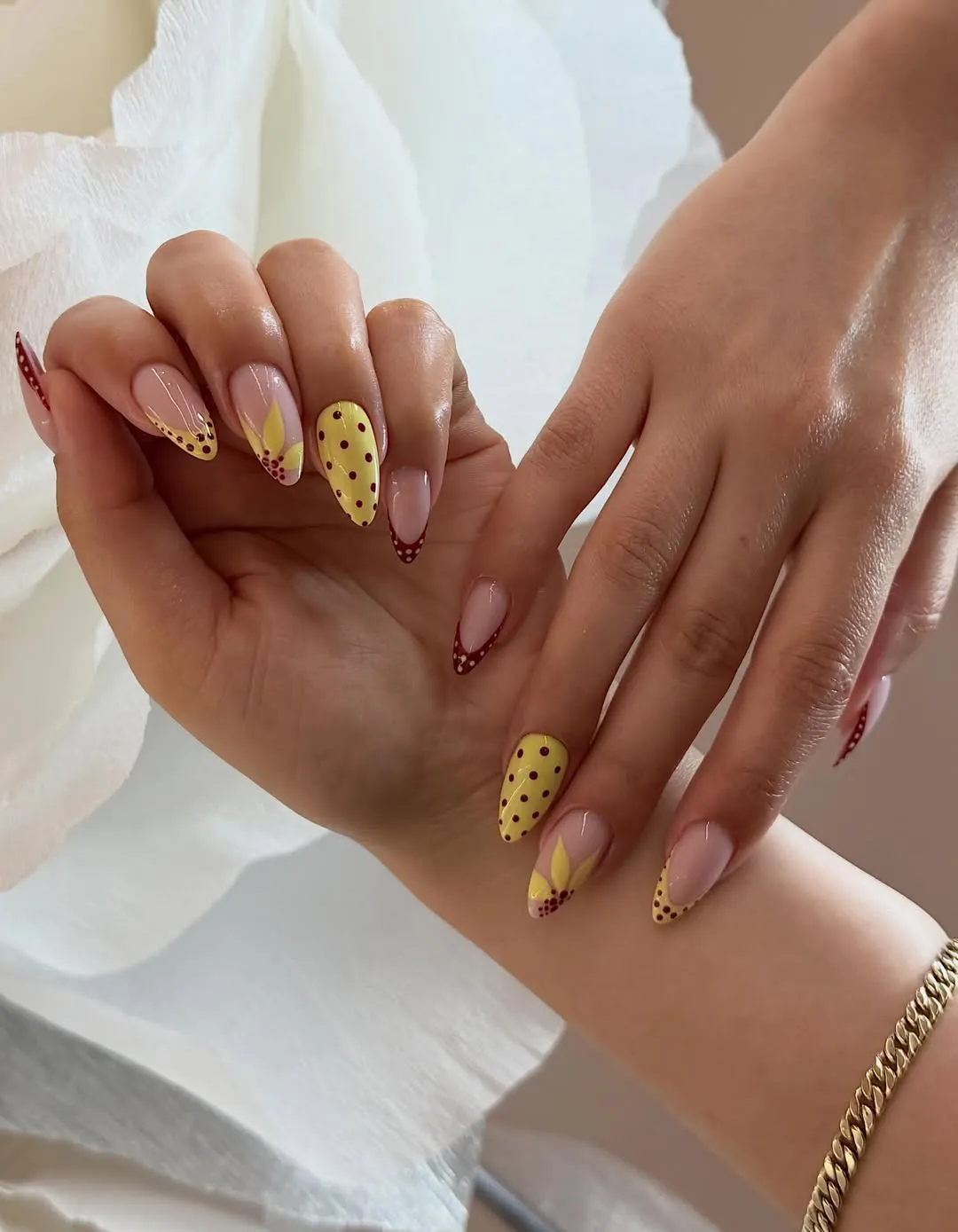 Yellow polka dots and burgundy dotted tips