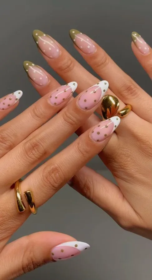 Olive-and-white French tips with gold polka dots