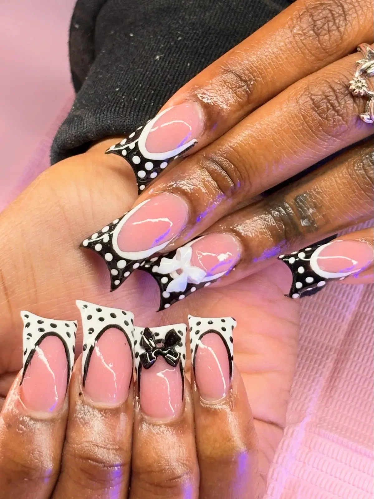 Flared polka-dot tips with raised bow accents