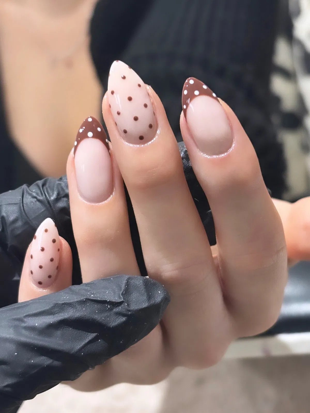 Brown polka-dot French tips with sheer dotted accent nails