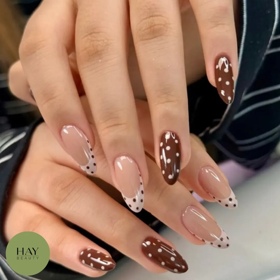 Nude and brown mix with white polka dots and curved lines