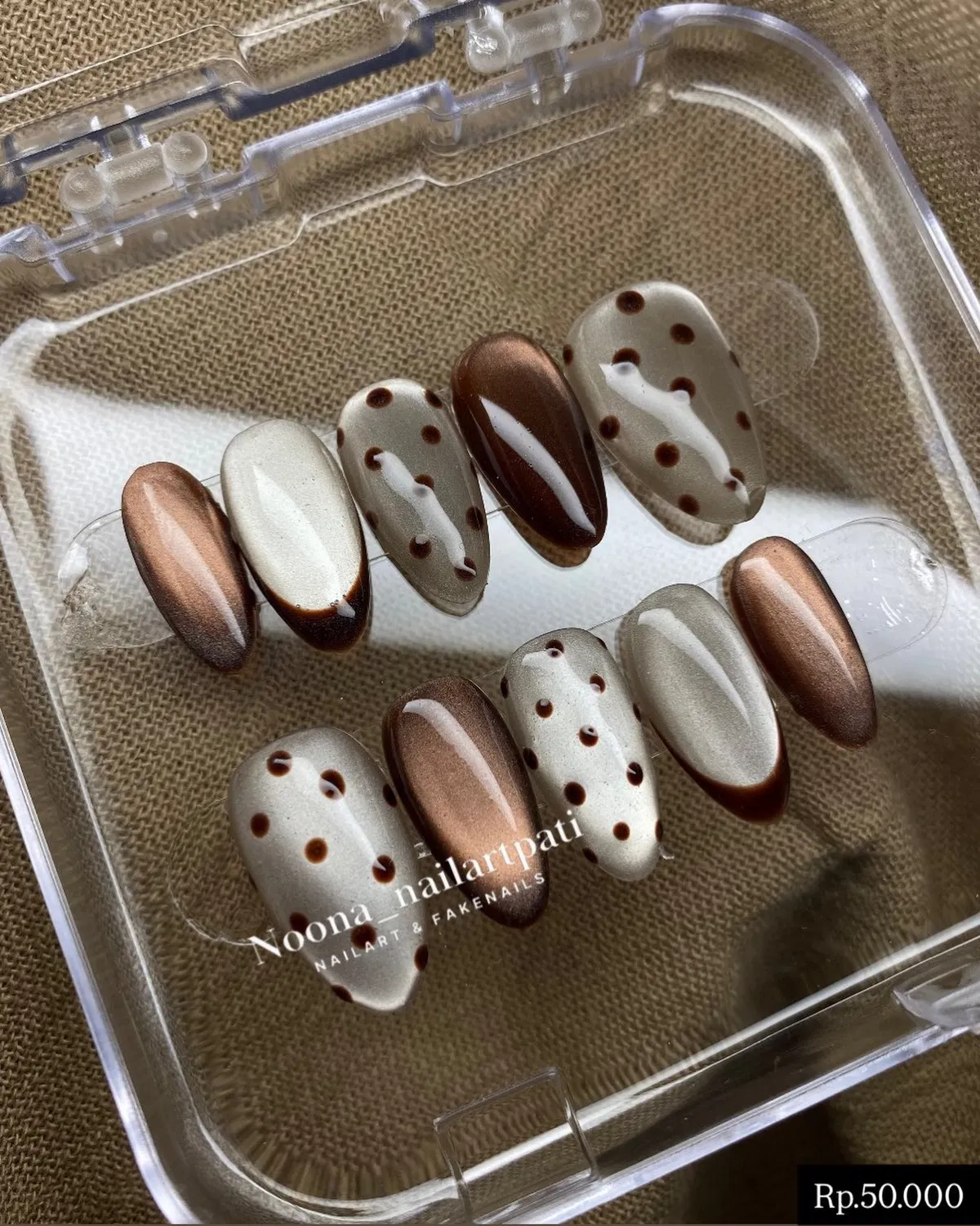 Metallic brown and gray polka-dot nail set in a case