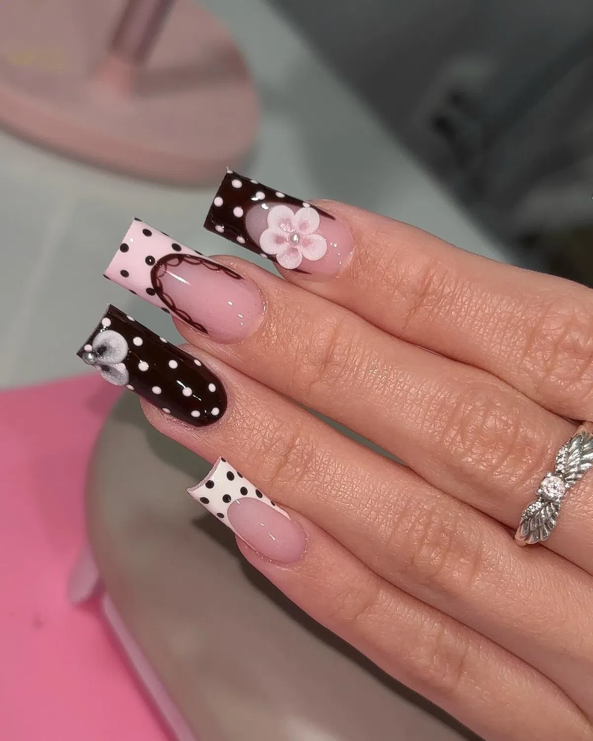 Brown polka-dot tips with floral accents