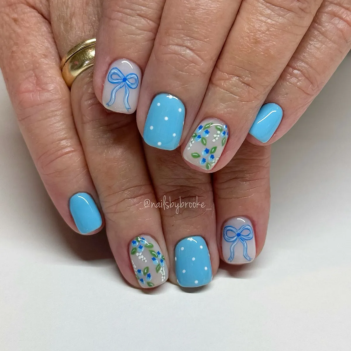 Light blue polka dots with bow and floral accents