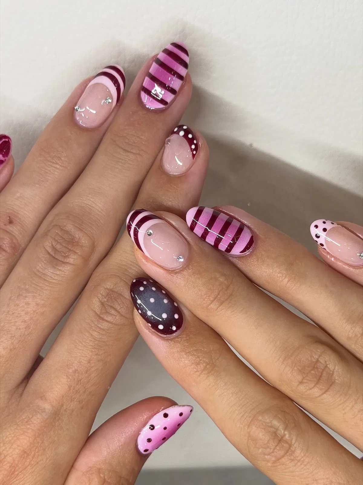 Striped pink set with polka-dot accent nails