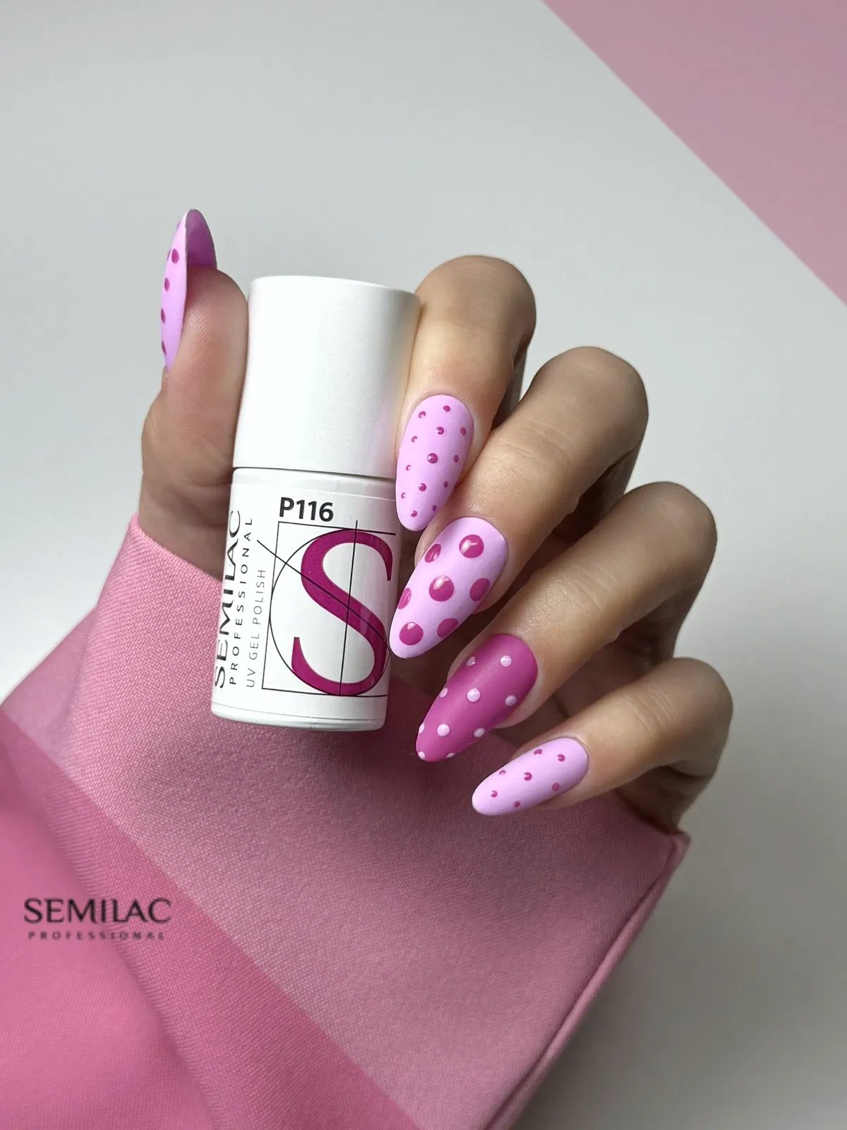 Matte pink nails with raised polka dots