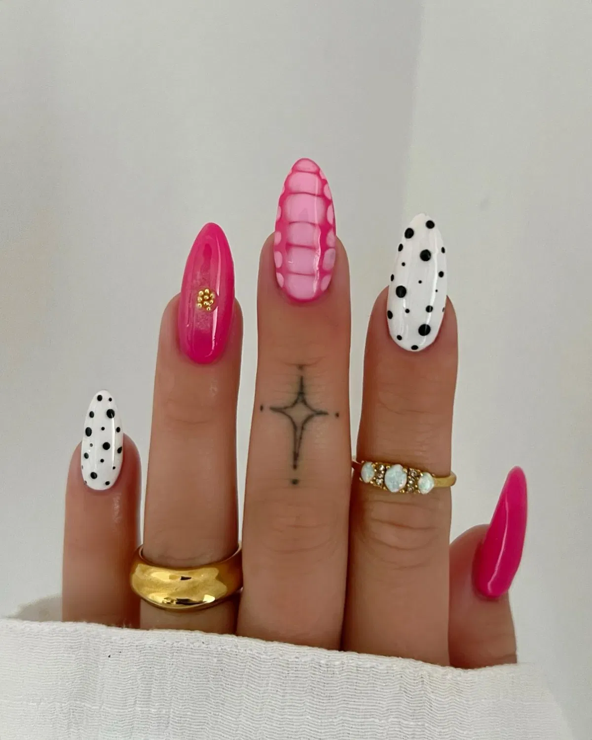 White-and-black polka dots paired with bright pink accents