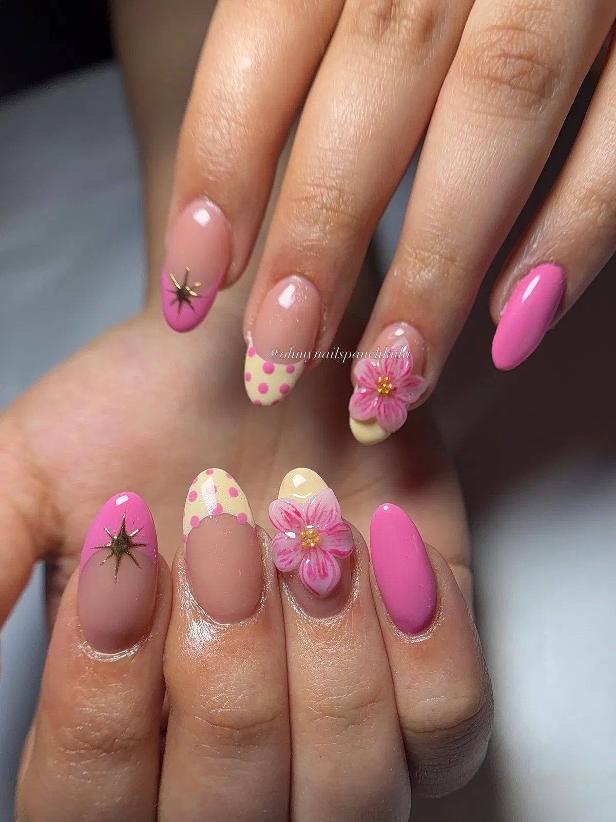 Cream-and-pink polka-dot tips with floral and starburst accents