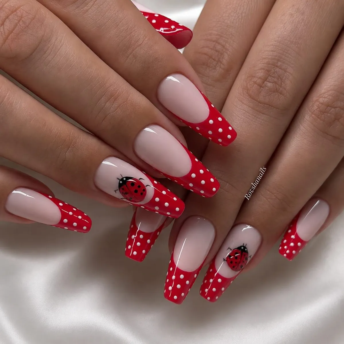 Red polka-dot French tips with ladybug accents