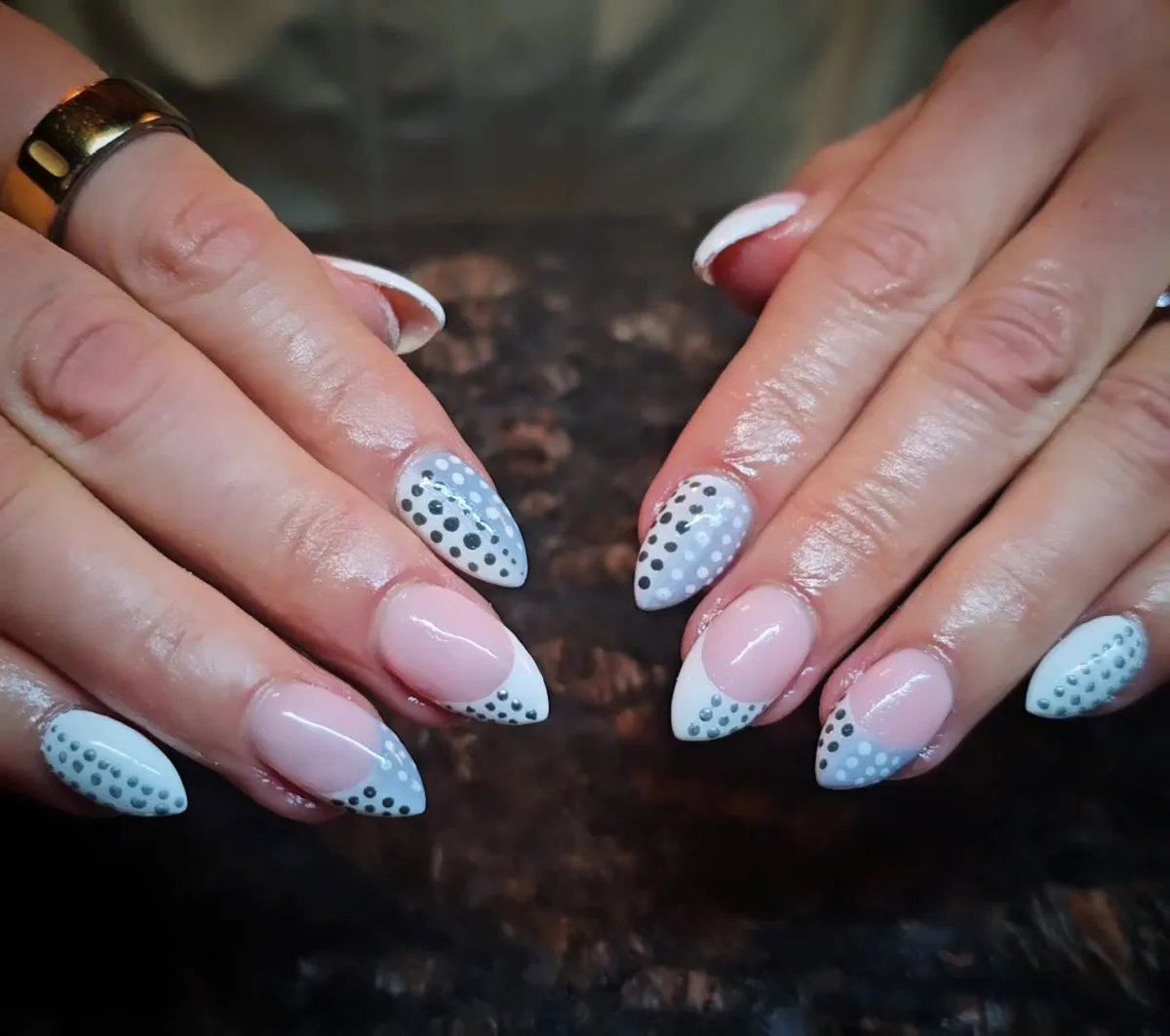 Soft blue-gray tips with mixed-size polka dots